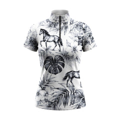 Studio flat view of the Monochrome Tropical Horse Print Short-Sleeve Quarter-Zip Riding Top, showcasing the full print details
