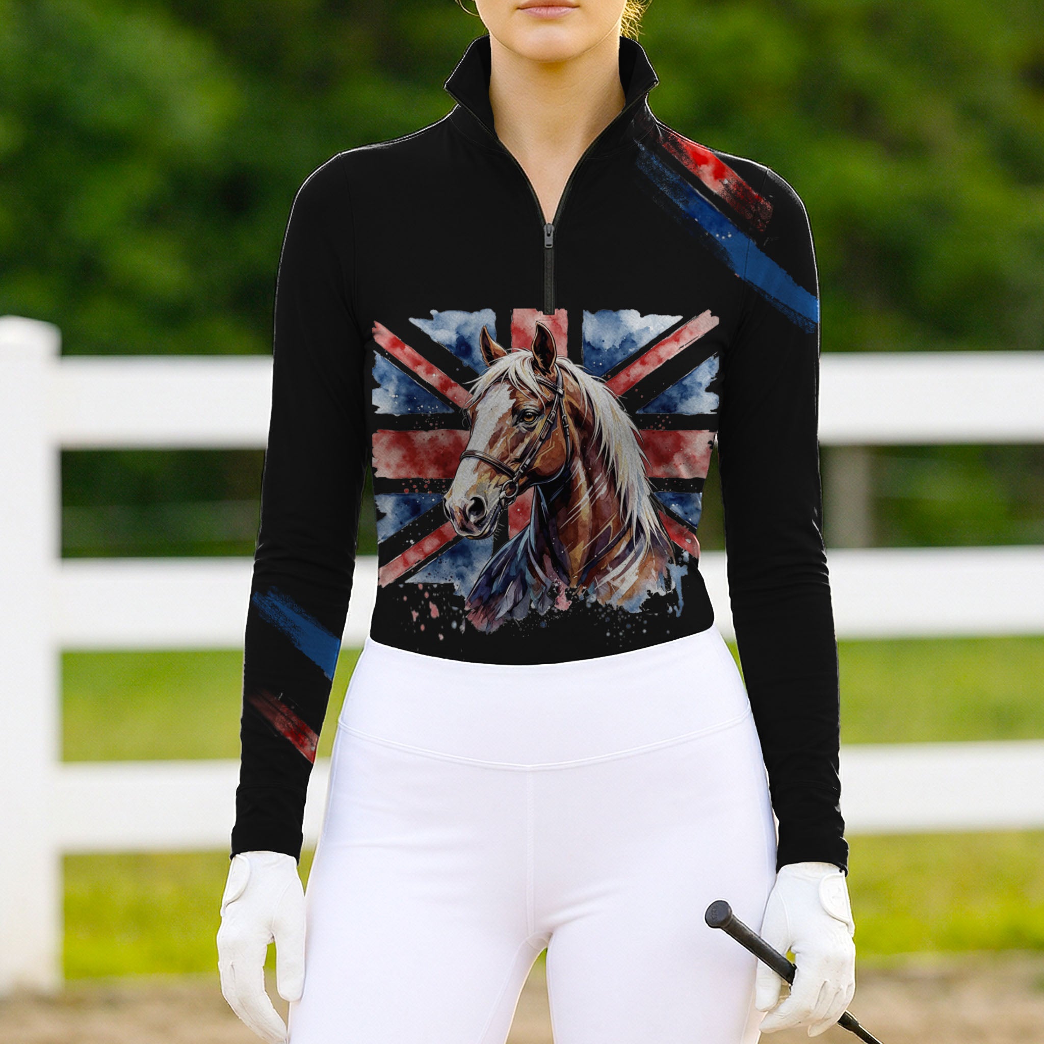 Woman wearing RIDER ATELIER British flag horse quarter-zip top at the show jumping arena