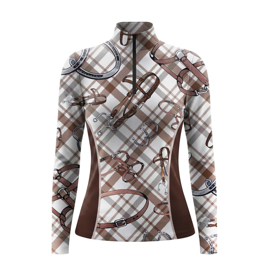 Studio shot of the RIDER ATELIER Brown Plaid & Equestrian Tack Print Long-Sleeve Quarter-Zip Riding Top, showing full plaid and tack print details, quarter-zip collar, and fabric texture against a clean white background