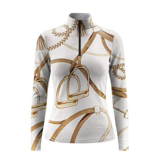 Studio flat view of the RIDER ATELIER Ivory Equestrian Tack Print Long-Sleeve Quarter-Zip Riding Top, showcasing the full tack print and quarter-zip collar