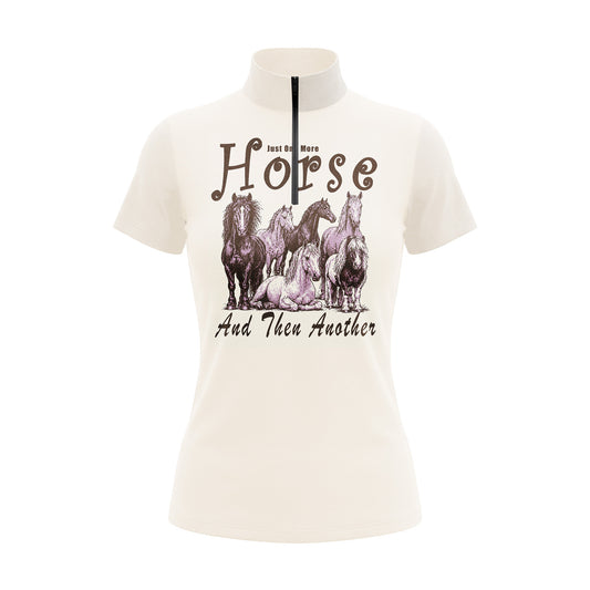 Studio flat view of the RIDER ATELIER "Just One More Horse" Graphic Print Short-Sleeve Quarter-Zip Riding Top, showcasing the full whimsical print and quarter-zip collar