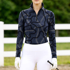 Woman wearing RIDER ATELIER luxury chain link quarter-zip top at the outdoor pasture