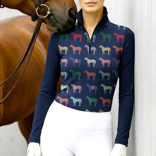 Woman wearing RIDER ATELIER multicolor horse silhouette navy quarter-zip top with a chestnut horse