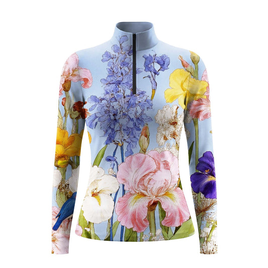Studio shot of the RIDER ATELIER Watercolor Iris & Peony Print Light Blue Long-Sleeve Quarter-Zip Riding Top, showing full floral print details, quarter-zip collar, and fabric texture against a clean white background