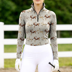 Woman wearing RIDER ATELIER watercolor show jumping quarter-zip top at the outdoor pasture