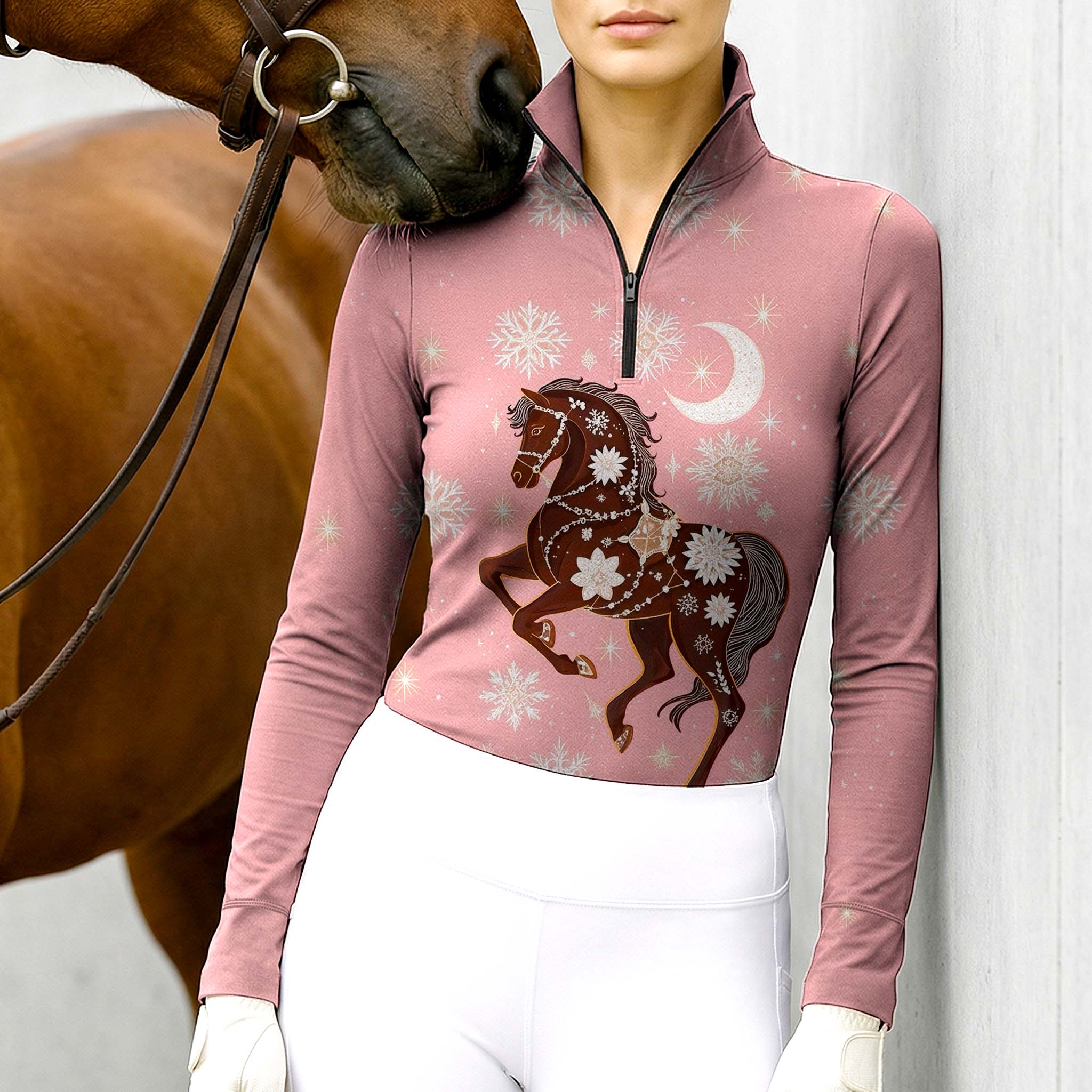 Woman wearing RIDER ATELIER winter celestial horse quarter-zip top with a chestnut horse