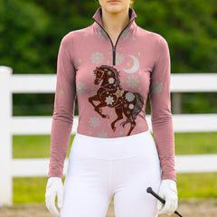 Woman wearing RIDER ATELIER winter celestial horse quarter-zip top at the outdoor pasture