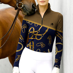 Woman wearing RIDER ATELIER Equestrian Tack Colorblock Quarter-Zip Top interacting with a chestnut horse at the stable