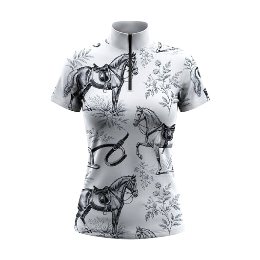 White background studio shot of white vintage toile horse & tack print short sleeve quarter zip riding top