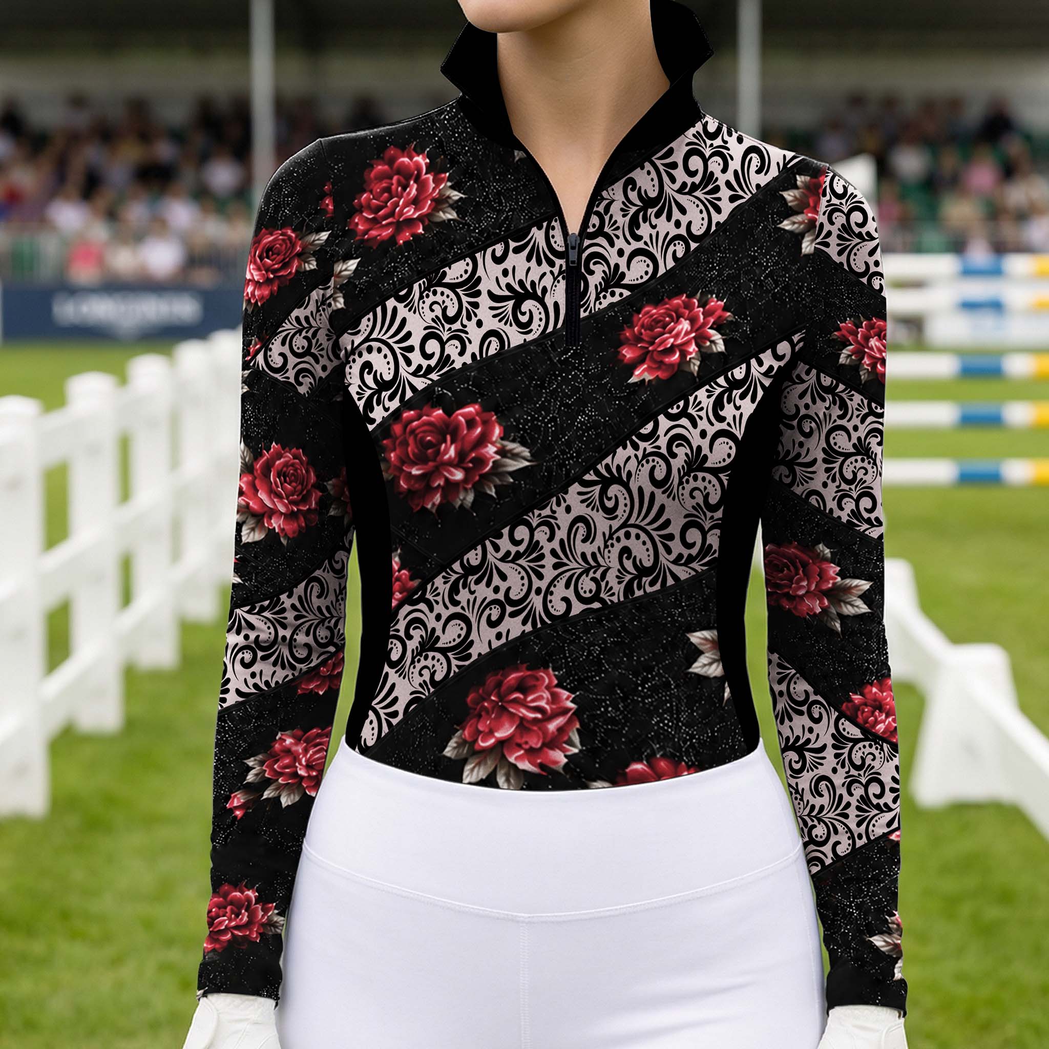 Close front view of the riding top worn with white breeches near show jumping arena fences