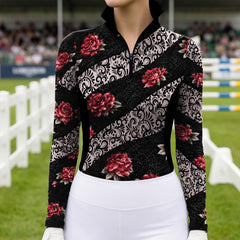 Close front view of the riding top worn with white breeches near show jumping arena fences