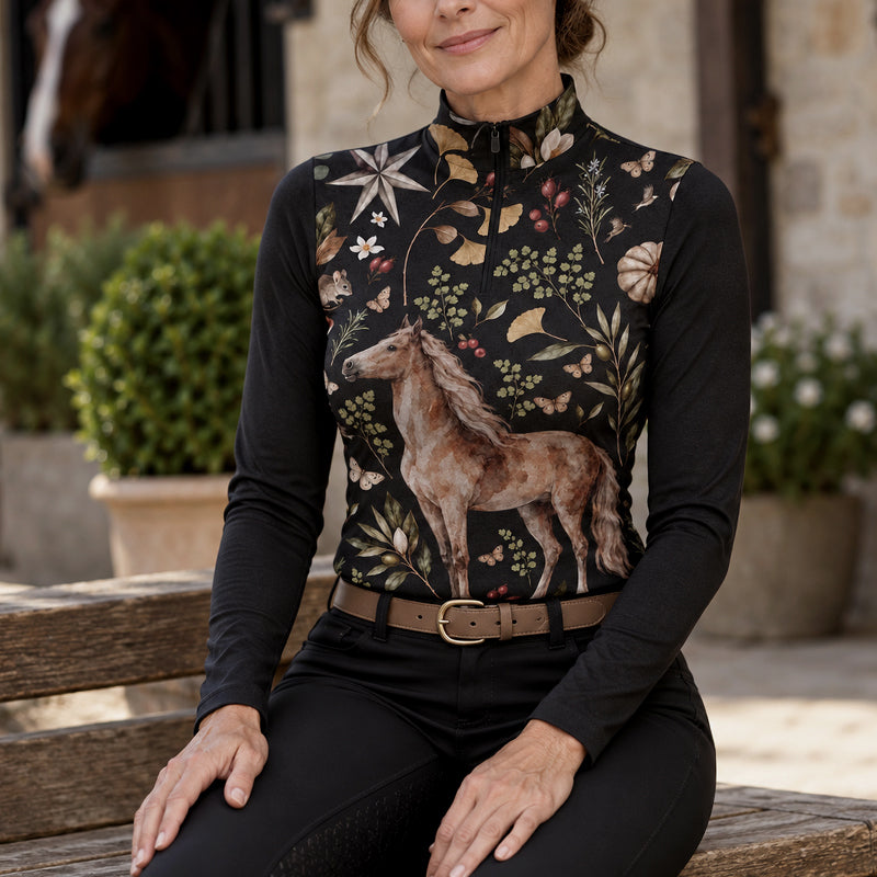 Black long sleeve riding top with chestnut horse and botanical print worn during casual barn time