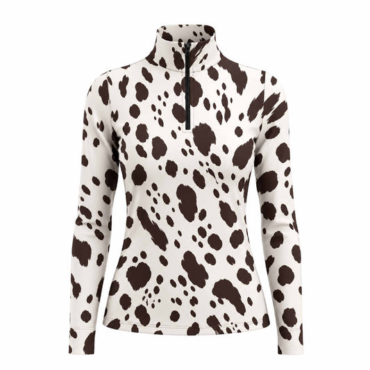 Off white long sleeve quarter zip riding top with irregular dark brown spotted pattern, standing collar and vertical black front zipper