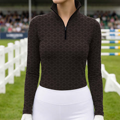 Closeup of the stand up collar and black quarter length zipper on the geometric print riding top