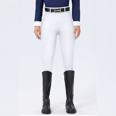Person wearing white riding pants with black boots on a white background