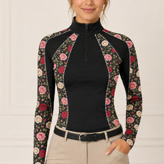 Clean white background studio product mockup of black long‑sleeve quarter‑zip riding top with vintage multi‑tone rose floral print and decorative rhinestone‑dot panel accents