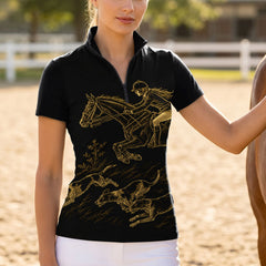 Golden hour outdoor fence shot of female rider wearing black short‑sleeve riding top with gold jumping rider and hunting hounds graphic