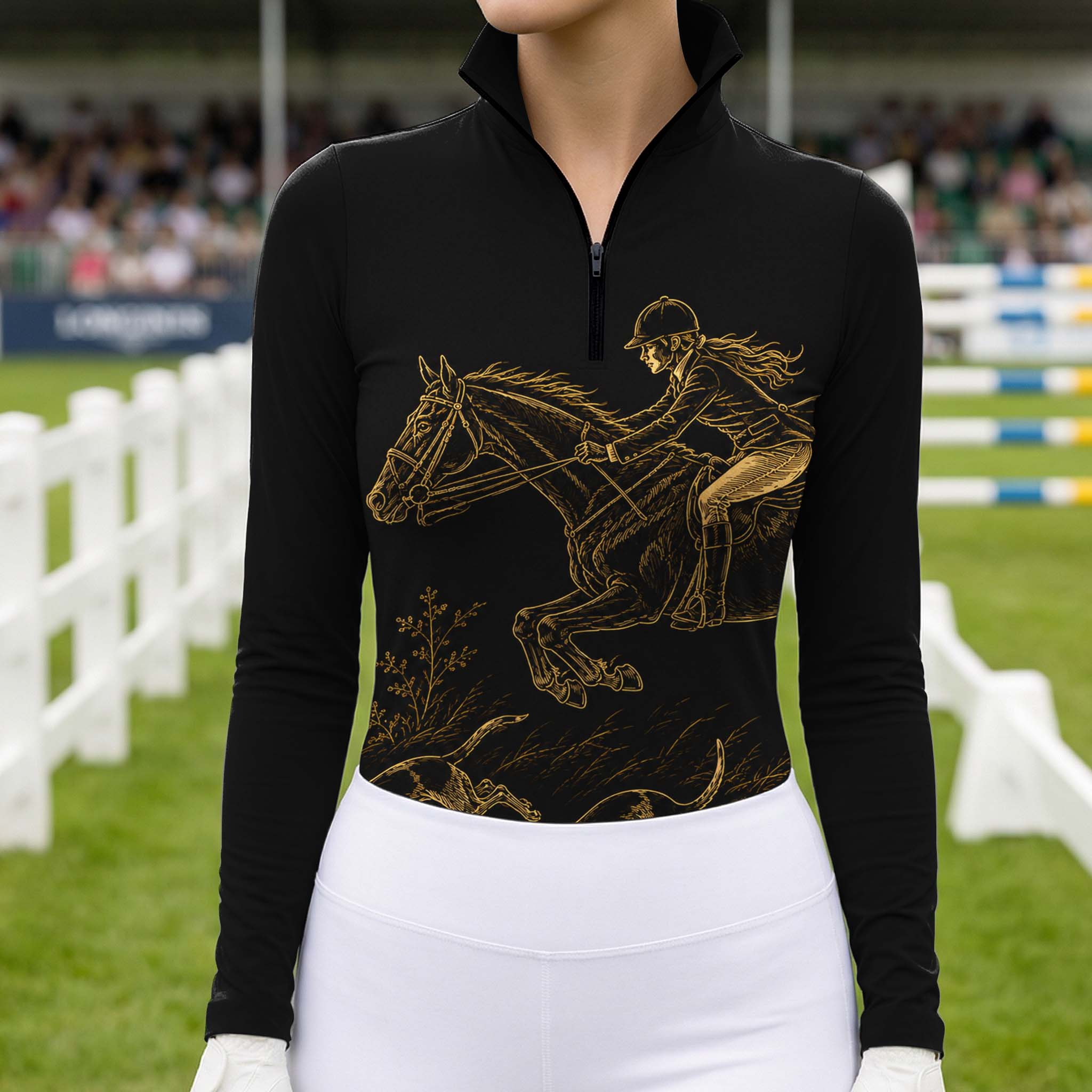 Equestrian show‑jumping arena model shot of rider in white breeches wearing black quarter‑zip riding top with gold hunt‑scene artwork