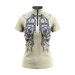Studio white‑background product mockup of women’s cream navy ornate bridle tack symmetrical print short‑sleeve quarter‑zip riding top with contrast navy collar