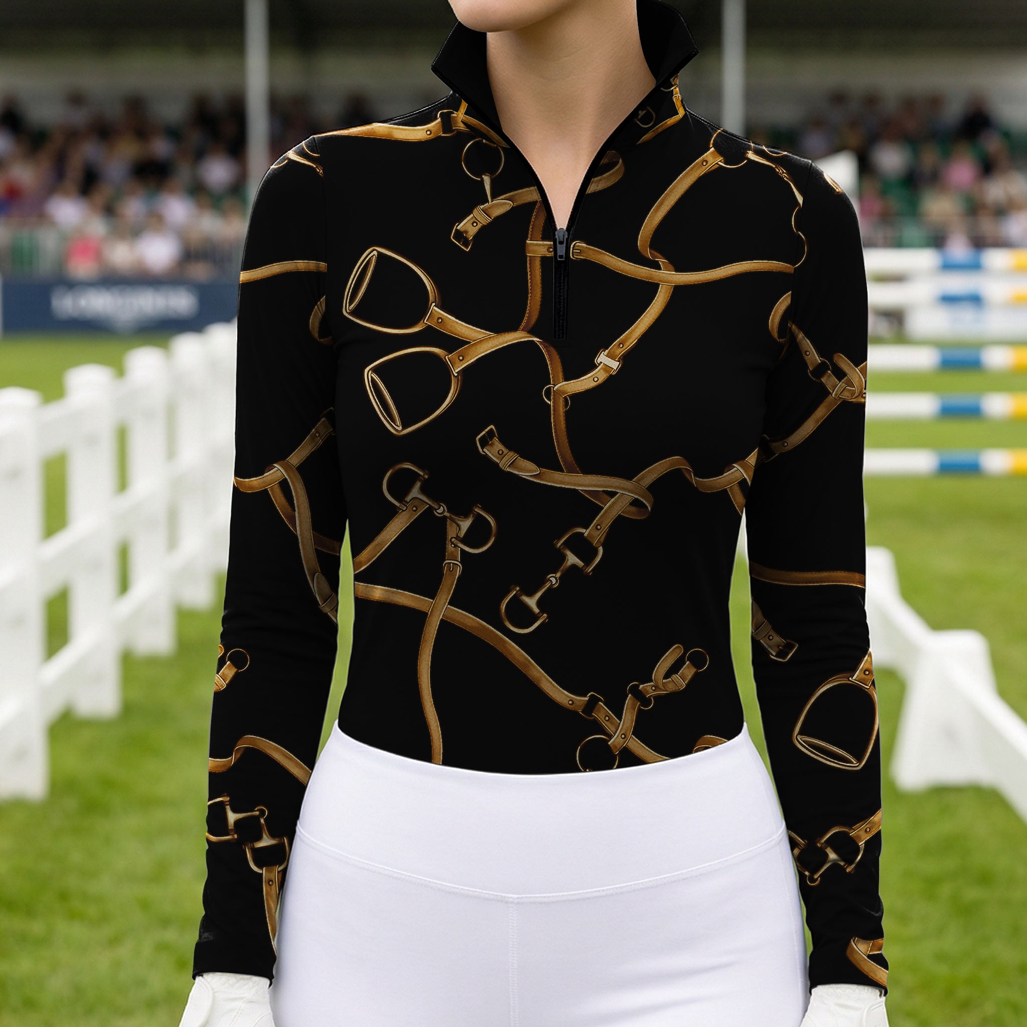 Equestrian‑show event close‑up shot of female equestrian wearing black golden bridle‑stirrup‑bit‑print long‑sleeve riding top