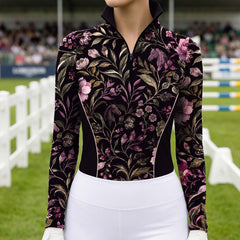 White background studio mockup of women’s black long‑sleeve quarter‑zip riding top with all‑over vintage purple floral and horse‑silhouette print, contrast piped side panels