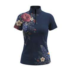 Studio white‑background product mockup of women’s navy short‑sleeve quarter‑zip riding top with full vintage rose and wild lupine side‑panel floral print