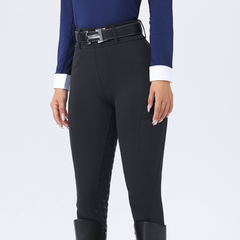 Person wearing black riding pants with a blue top on a white background