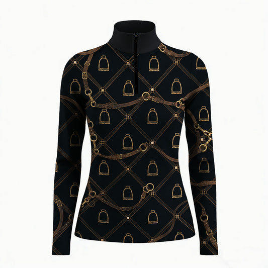 Studio white‑background product mockup of women’s black long‑sleeve quarter‑zip riding top with full antique gold vintage bridle stirrup lattice all‑over print
