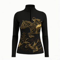Studio white‑background product mockup of black long‑sleeve quarter‑zip riding top with gold line‑art jumping rider and hunting hounds print