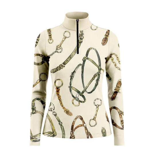 Studio white‑background product mockup of women’s cream off‑white long‑sleeve quarter‑zip riding top with full watercolor horse‑tack hardware all‑over print