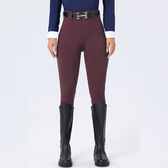Maroon riding pants with black boots on a white background