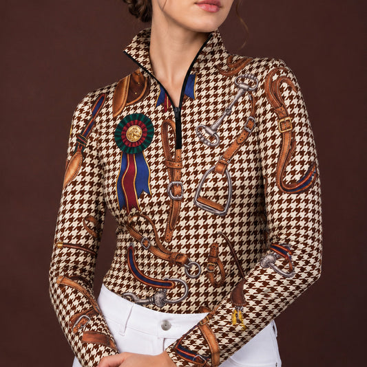 Clean white background studio product mockup of charcoal long‑sleeve quarter‑zip riding top with exclusive vintage equestrian tack zebra leopard mixed‑motif all‑over print