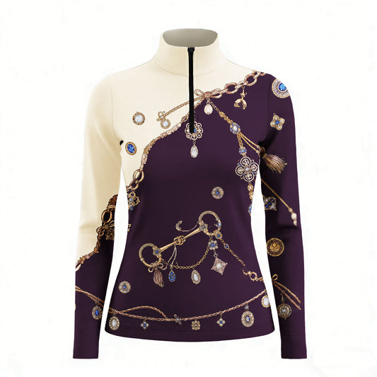 Clean white background studio product mockup of cream‑deep purple color‑block long‑sleeve quarter‑zip riding top with exclusive vintage golden chain, bit and gem‑jewelry diagonal print