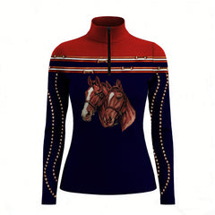 Studio white‑background product mockup of women’s red‑shoulder navy‑base long‑sleeve quarter‑zip riding top with dual horse portrait front print and striped trim