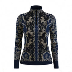 Equestrian show ground portrait shot of rider in navy‑black vintage golden carousel horse scroll‑filigree print riding top, leaning on white fence with white breeches and white riding gloves