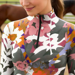 Close-up view of the sunset palette version of the Abstract Watercolor Floral Print Long-Sleeve Riding Top, highlighting the print details
