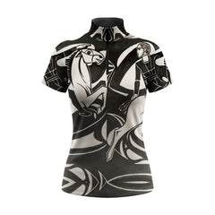 Close-up shot of model adjusting the black half-zip stand collar of the Art Deco monochrome equestrian short sleeve riding top at sunny pasture grounds
