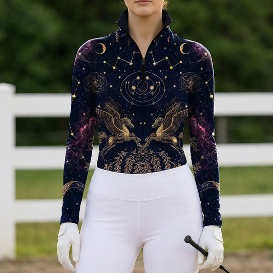 Outdoor farm fence arena shot of female rider wearing midnight navy celestial pegasus constellation galaxy long‑sleeve riding top
