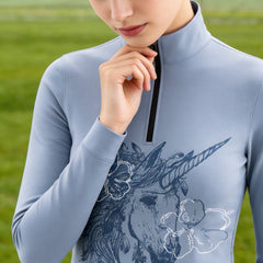 White background studio shot of solid muted dusty blue boho hand-drawn sketch feather unicorn white outline flower chest graphic long sleeve quarter zip riding top
