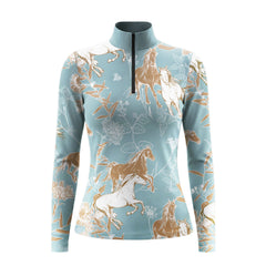 White‑background studio mockup of dusty‑blue long‑sleeve quarter‑zip riding top with horse‑botanical sketch all‑over print