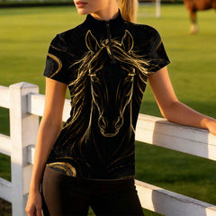 Model leaning on white wooden pasture fence displaying the tailored slim fit and luxury golden horse line art print
