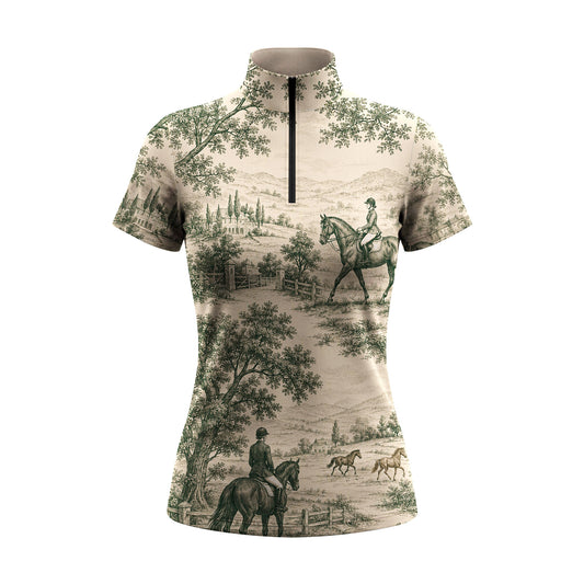 White background studio shot of cream base green vintage toile pastoral horse rider short sleeve quarter zip riding top