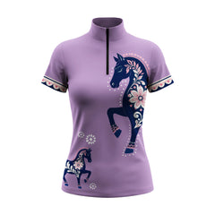 White background studio shot of lilac folk floral horse print short sleeve quarter zip riding top