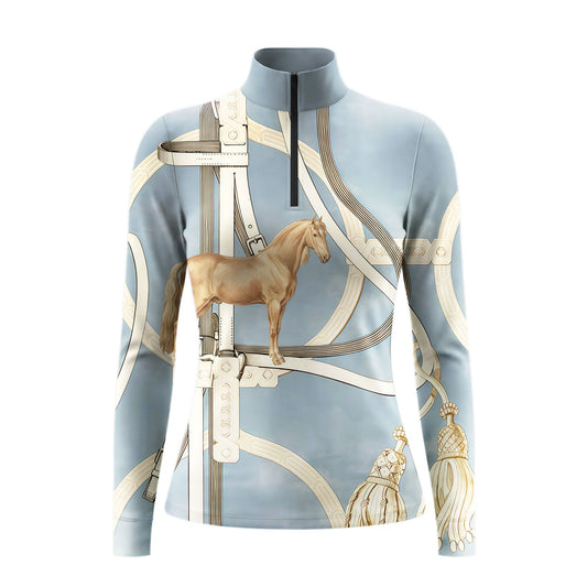 White background studio product shot of full light sky blue luxury vintage equestrian leather saddle bridle galloping horse cream tassel all-over print long sleeve quarter-zip riding top
