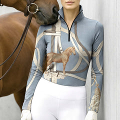Soft indoor light white wall side shot of model leaning beside chestnut horse wearing pale sky blue luxury classic saddle bridle horse tassel full print riding top
