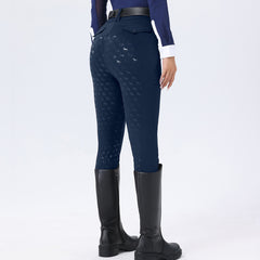 Navy riding pants with subtle pattern worn by a person on a white background