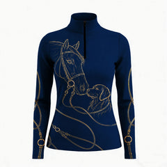 Equestrian show‑jumping arena close‑up model shot of rider wearing navy quarter‑zip riding top with gold horse‑retriever line‑art graphic