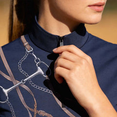 Close-up shot showing stand collar, zipper hardware and detailed equestrian tack front print on navy riding top