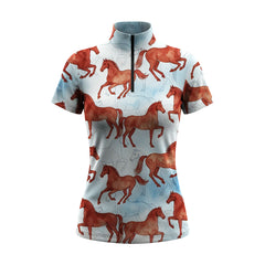 White background studio shot of pale sky blue dual-layer watercolor chestnut galloping horse allover print short sleeve quarter zip riding top