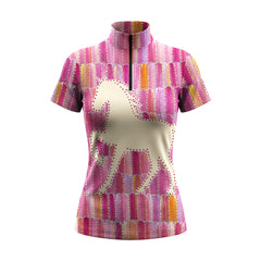 Golden hour countryside paddock lifestyle photo of female equestrian wearing pink patchwork galloping horse silhouette short sleeve quarter-zip riding top